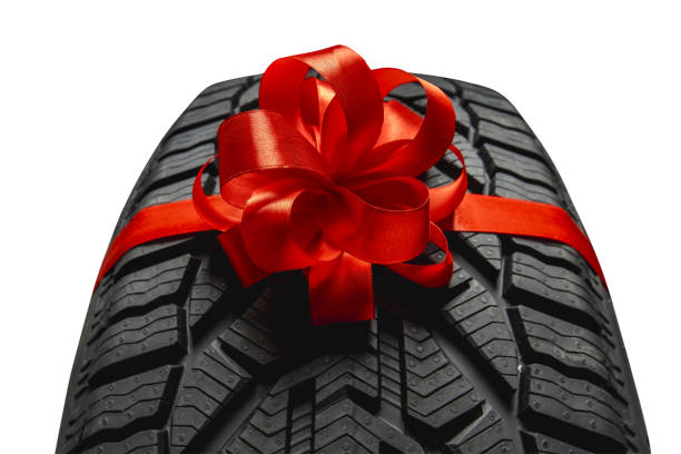istock black isolation rubber tire, and bow for christmas 1811014768