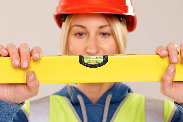 istock Female construction worker checking the spirit level 181101497