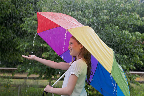 雨の日の夏 - rain drenched one person standing ストックフォトと画像