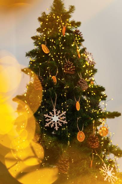 istock Closeup of decorations on a Christmas tree with lights 1811017906