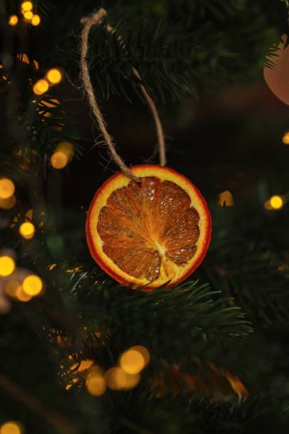 istock Closeup of decorations on a Christmas tree with lights 1811017920