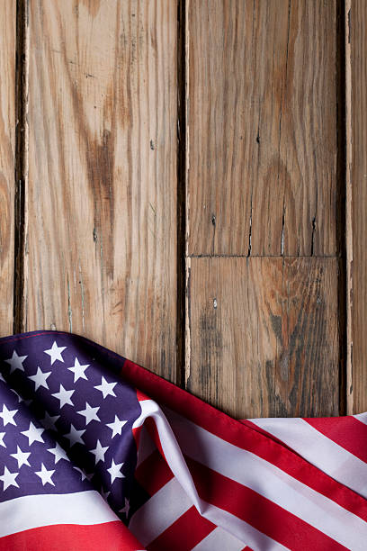 istock American flag on wooden background 181102157