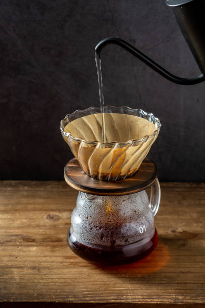 istock Coffee dripping equipment on wooden background 1811029111