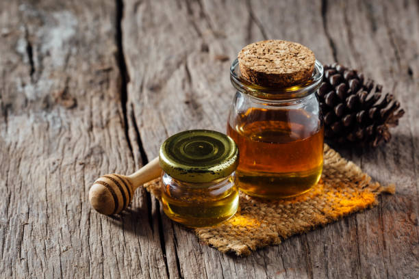 istock natural honey on wooden background 1811029615