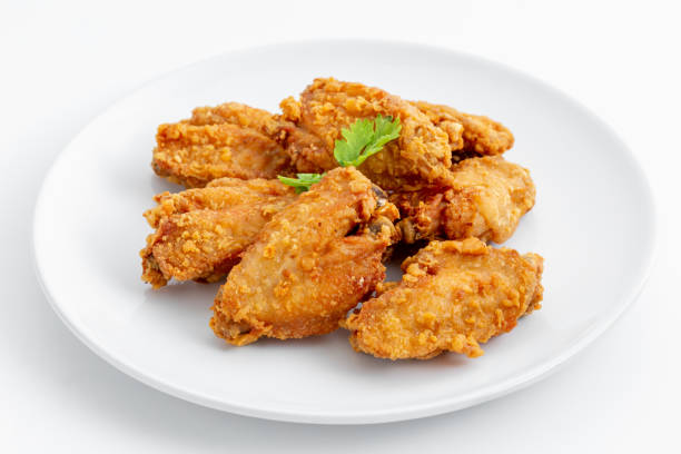 fried chicken wings on white background stock photo