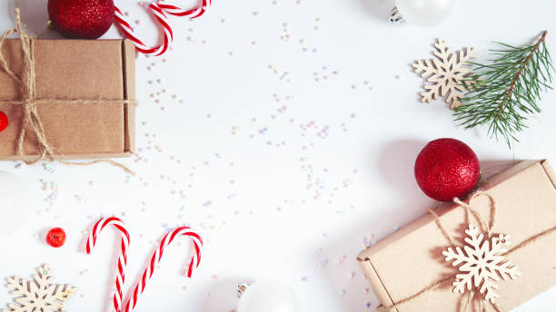 istock Christmas composition with gift boxes, decorations, snowflakes on a white background. Top view. Copy space 1811032828