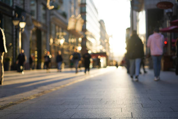 Blurred background. Blurred people walking through a city street