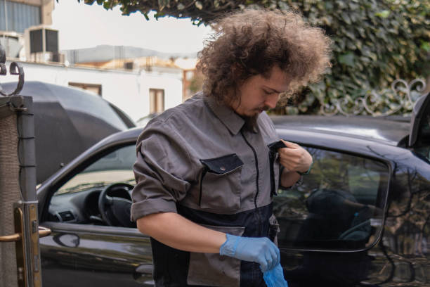 istock Young man doing a scheduled regular tune-up on his car 1811056565