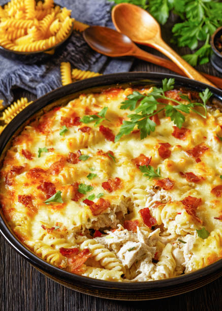 istock fusilli pasta bacon cheese chicken bake, top view 1811083651