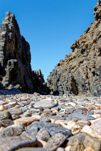 rocky coast in aguas verdes playa del valle fuerteventura canary islands , spain - light sea low tide fuerteventura imagens e fotografias de stock