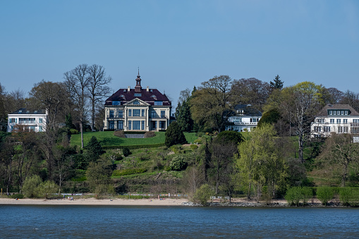 Hamburg, Germany - 04 17 2023: View from the Elbe to villas in Hamburg Blankenese