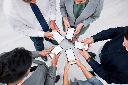 Business people, hands and phone screen in circle for networking, communication and mockup. Contact, connectivity and professional team with smartphone, mobile app or internet search with web space.