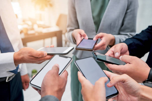 istock Business people, hands and phone in circle for networking, communication or collaboration. Contact, connectivity and professional team with smartphone, mobile app or internet search with technology. 1811114465