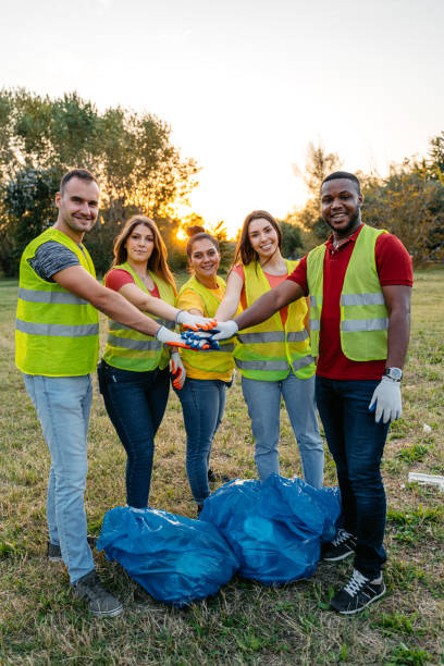 istock Nature Conservation Volunteers Having A Team Handshake In The Nature 1811128232