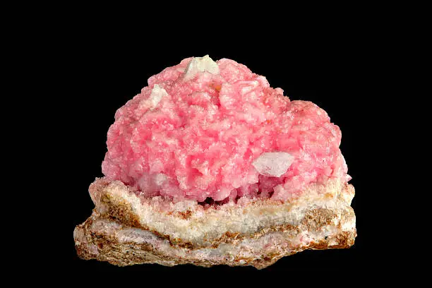 Rhodochrosite is a manganese carbonate mineral with chemical composition MnCO3. In its (rare) pure form, it is typically a rose-red color, but impure specimens can be shades of pink to pale brown.