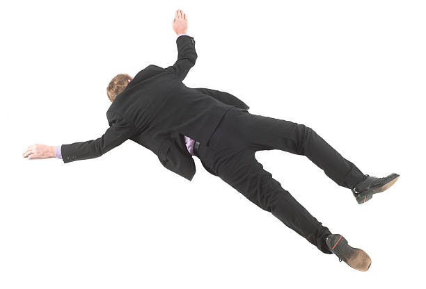 Business man covering on floor isolated in white