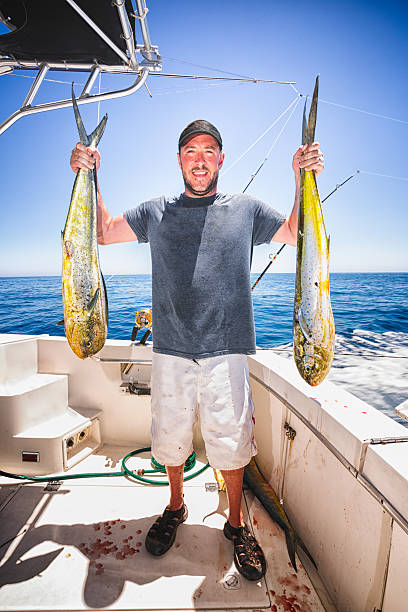 istock Young Man Holding Trophy MahiMahi 181115655