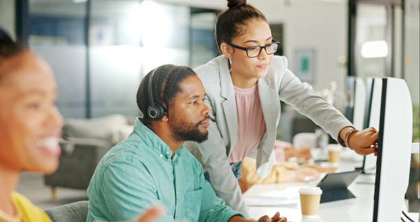 istock Call center, training and consultant people on computer for technical support or advice, helping and IT solution. Professional manager or business woman for information technology or desktop feedback 1811158579