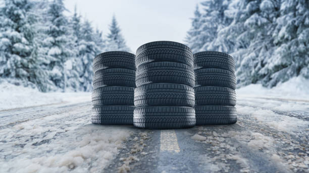 set of winter tires on the road in the snow - street fog profile imagens e fotografias de stock