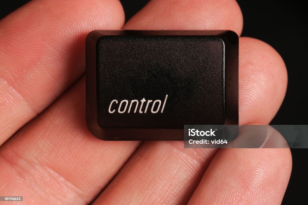 Take Control A computer keyboard's control key held in the hand Computer Keyboard Stock Photo