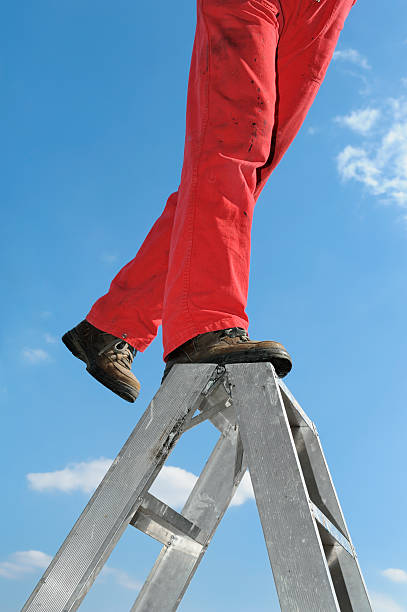 istock Man standing on the ladder 181116667