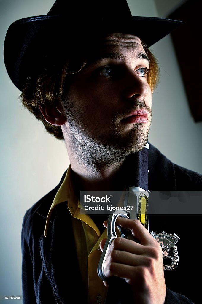 Sad Sheriff Old West sheriff looking off into the distance reflecting on days past. Adult Stock Photo