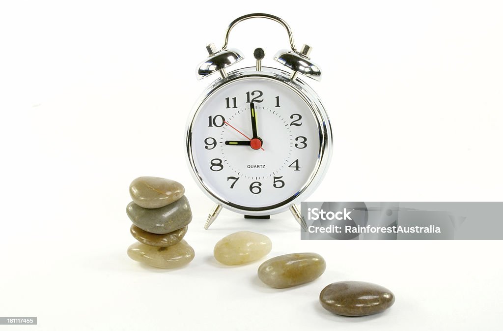 alarm clock Alarm clock and stones. 9 O'Clock Stock Photo