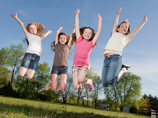 istock Young Girls Jumping for Joy 181117677