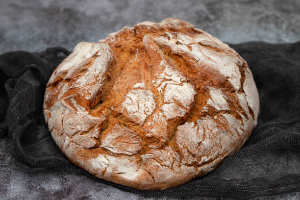 istock freshly baked bread loaf on yellow napkin 1811177809