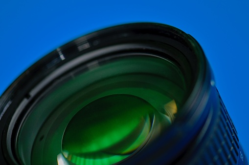 Front view of photo lens isolated on black background