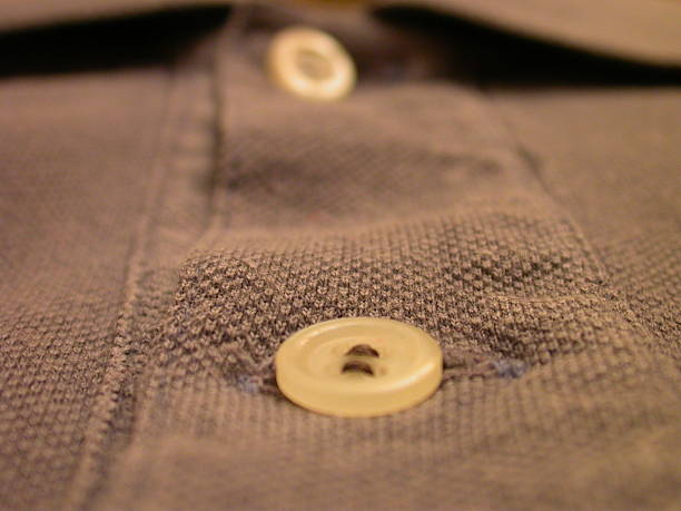istock Polo shirt and button closeup 181119119