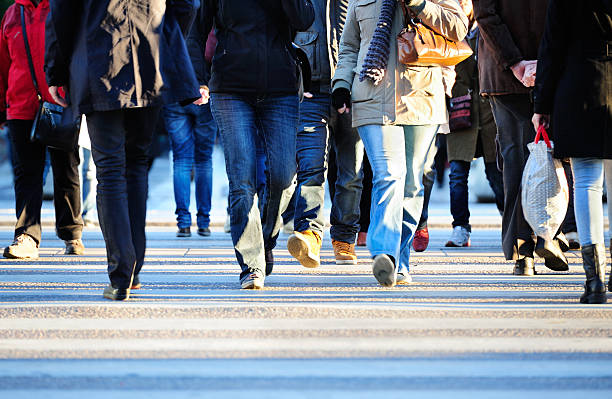 istock Pedestrians crossing street 181119442