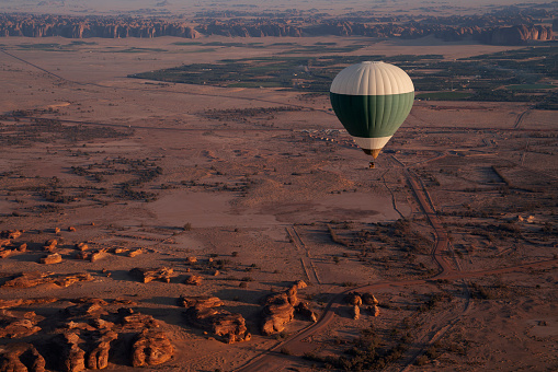 Aerial view of a European landscape from a hot air balloon with a loving couple, 3d render with photo element.