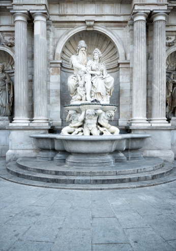Neptune Fountain next to Albertina Museum in Vienna, Austria. Famous Landmark in downtown Vienna.