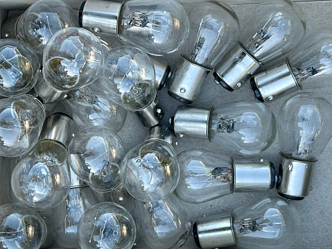 Full frame of glass lightbulbs