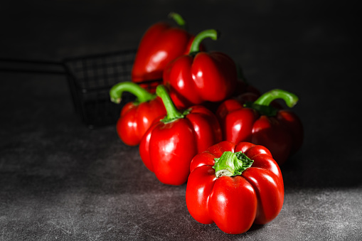 peppers on a wooden plate