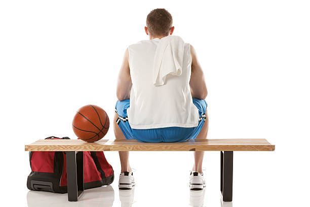 istock Rear view of a basketball player sitting on bench 181122074