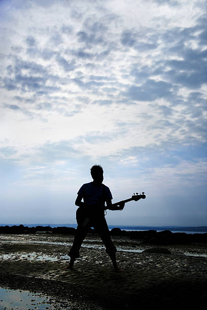istock Musician on the beach 181122470