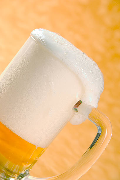 Glass of Beer "Glass or mug of Beer, rotated, Glasses of Beer:" froth beer bubble quencher stock pictures, royalty-free photos & images