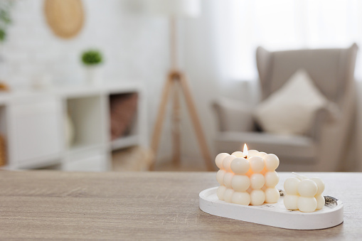 handmade white candles and copy space on the table at home