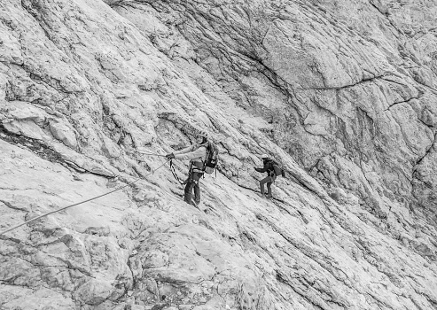 Gran Sasso, Italy - 22 October 2023 - The extreme trekking in Corno Piccolo, above 2600 meters in Abruzzo region, with Ferrata Brizio and Ferrata Ventricini climbing ways. Here a view with alpinists and ferrata Brizio, now named 