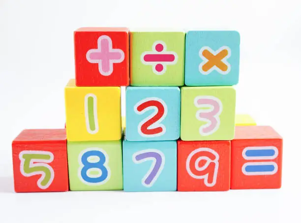 Photo of Number wood block cubes for learning Mathematic, education math concept.