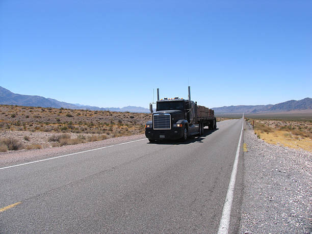 istock truck driving by in death valley 181127704