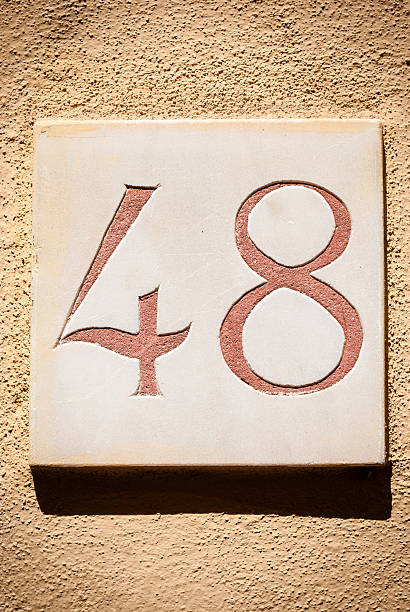 Number 48 in a marble plaque on the wall