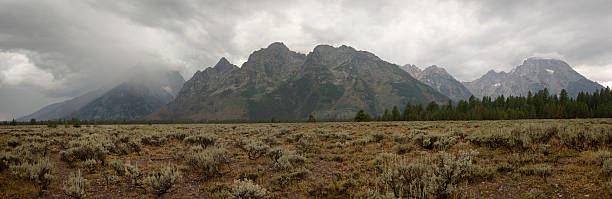 Rain over the Tetons "Rainfall and storm clouds over the Teton Range, Grand Teton National Park, Wyoming. See also:" snake river valley grand teton national park stock pictures, royalty-free photos & images