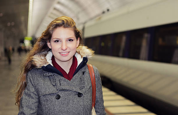 istock Woman at train station 181128867
