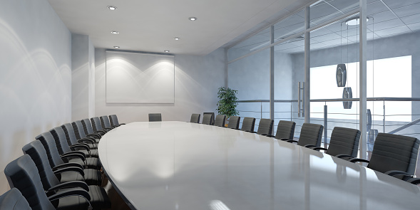 Conference table and chairs in empty meeting room