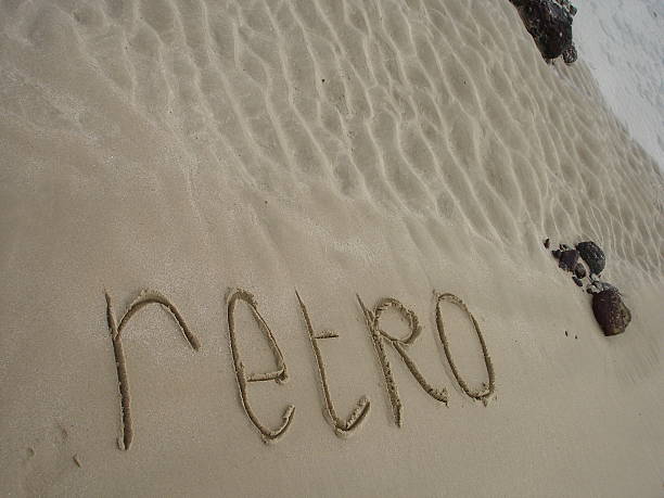 Retro written in the beach sand stock photo