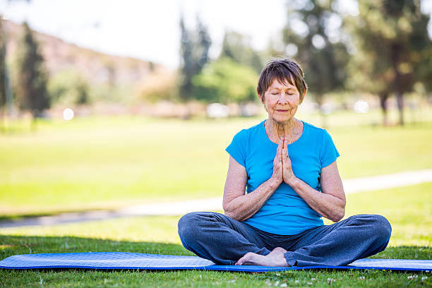 istock Senior Woman Practicing Yoga 181129217