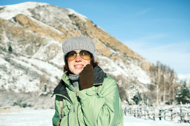 istock 46-year-old female hiker is looking at winter mountain view 1811294484